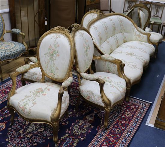 A Louis XV style giltwood nine-piece salon suite